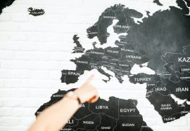 Pointing with hand on a map